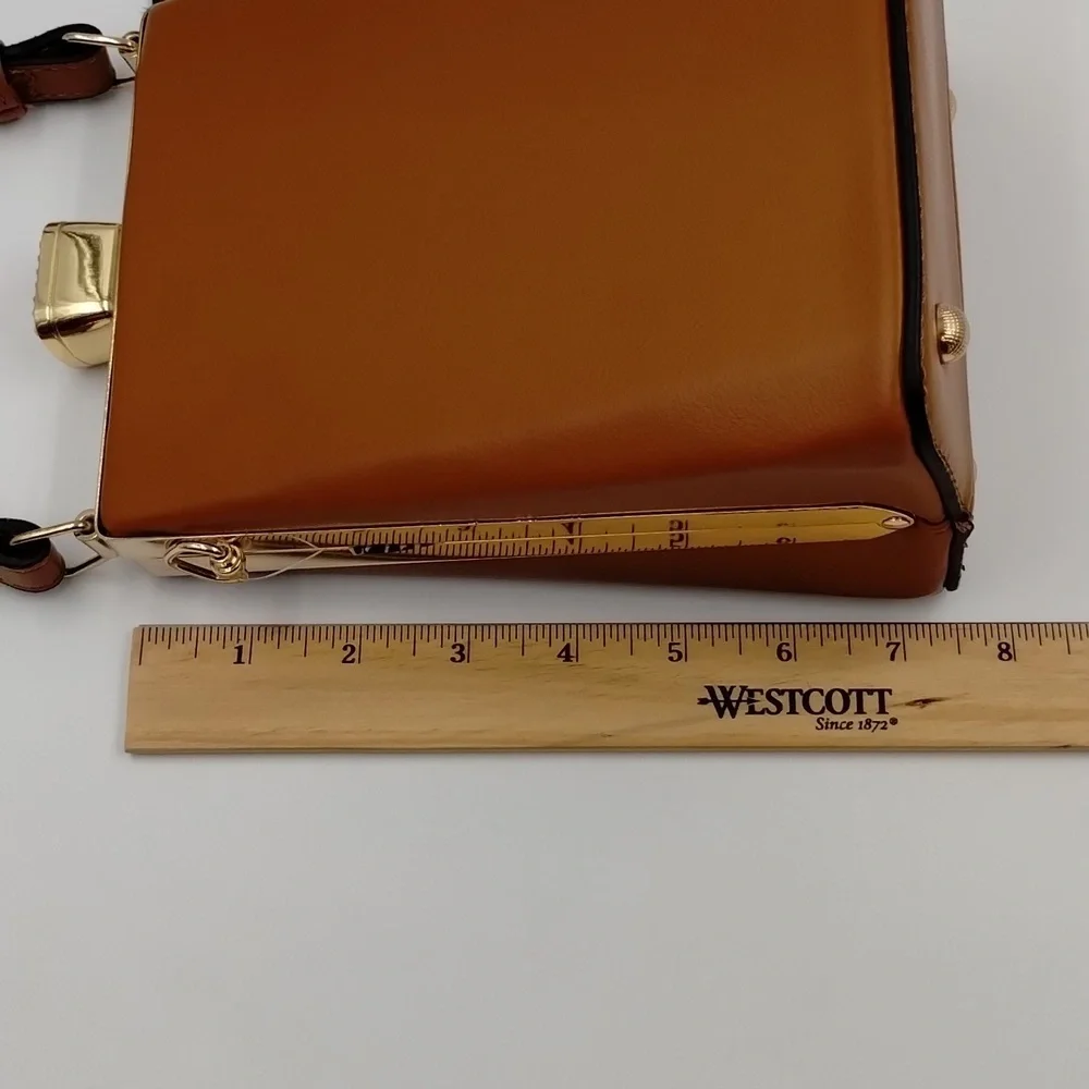 Sophisticated Brown Baby Bag with Gold Accents